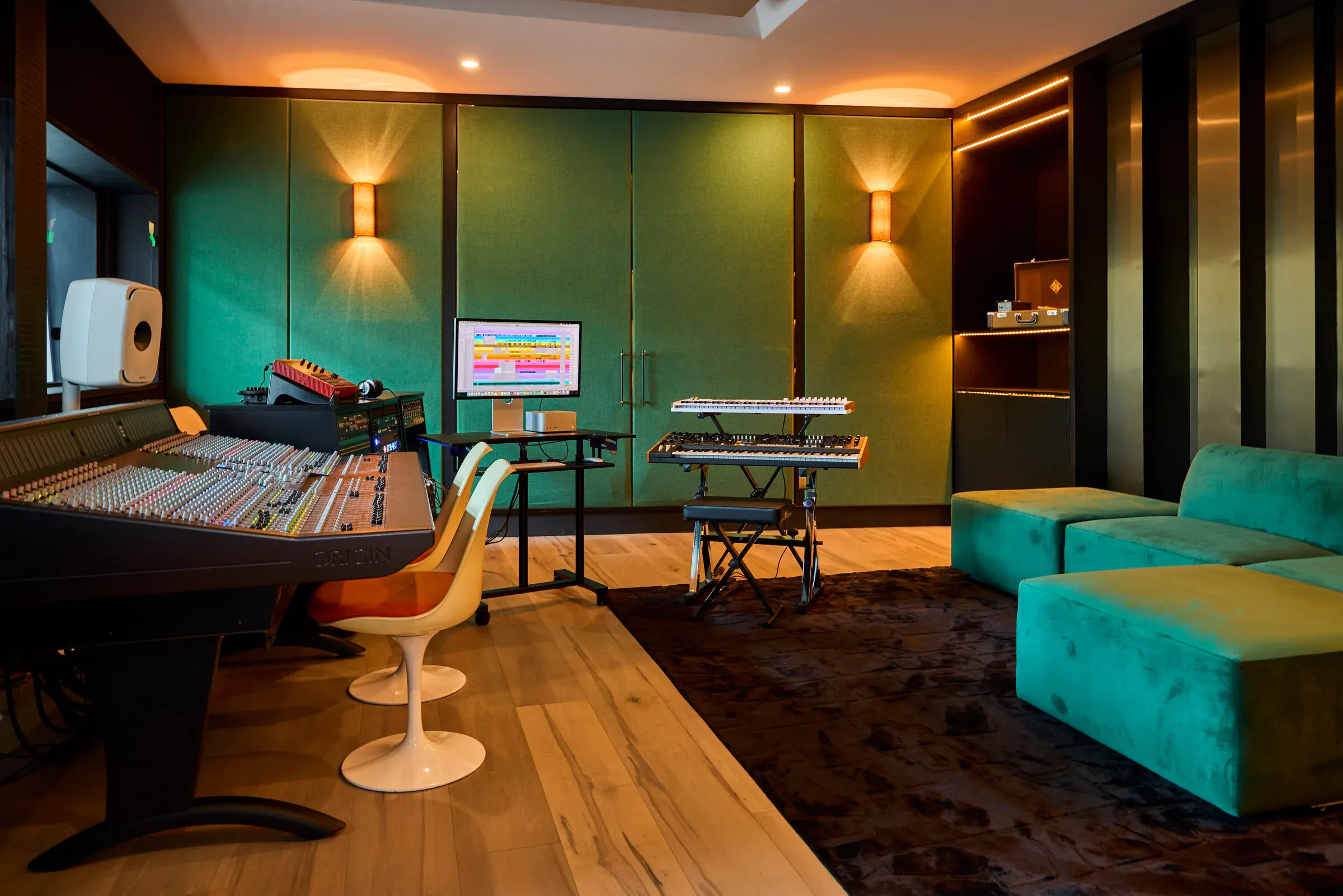 Verdant Sound control room — SSL Origin console, two Genelec 8351B monitors, green velvet walls